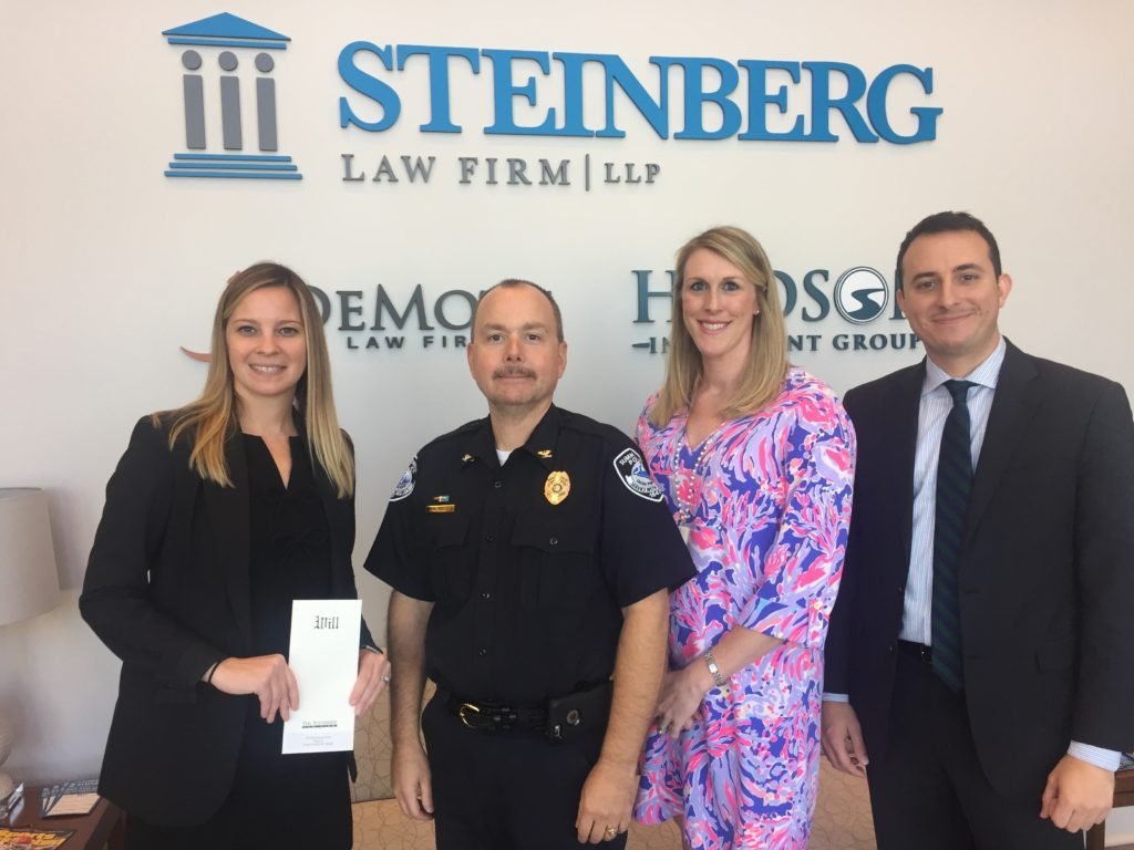 Steinberg Attorney Kelly Alfreds and Catie Meehan with Police Officers