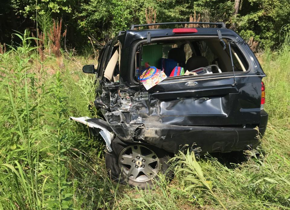 Our client's vehicle was hit so hard that it was crushed beyond repair and was pushed off the road and into the woods.
